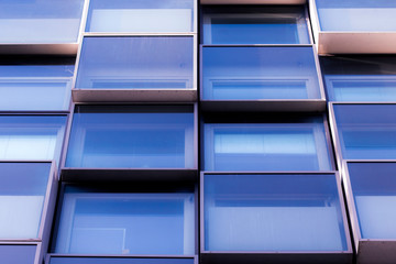 Modern office building windows. Glass wall of office building. Dirty glass facade. 