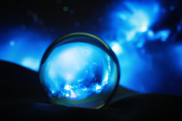 Fototapeta na wymiar Astrological background. Crystal ball with predictions. Horoscope of the stars. Fortune telling and determination of fate. Soothsayer with a crystal ball.