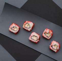Japanese rolls on stone background.
