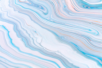 Obraz premium Fluid art texture. Abstract backdrop with swirling paint effect. Liquid acrylic artwork with flows and splashes. Mixed paints for background or poster. Blue, white and orange overflowing colors