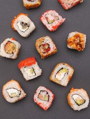Japanese rolls on stone background.