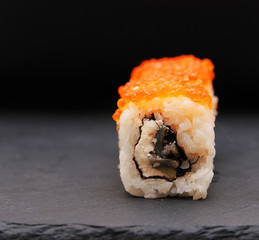 Japanese rolls on stone background.