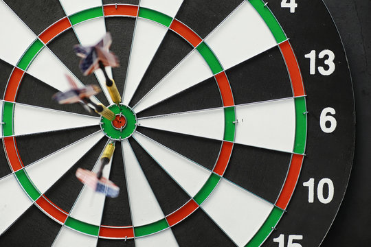 Darts. The dart for playing in the game board is stuck. Hit the sector in darts. The concept of a successful strategy.
