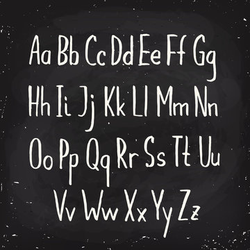 Hand drawn alphabet written with pen in blackboard design.