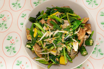 Stir fry vegetables with chicken and tofu.