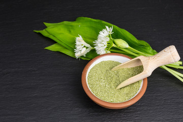 bowl of dried wild garlic salt on slate plate
