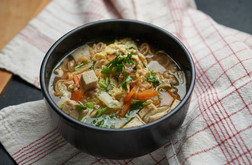 The noodle soup in a Japanese black bowl