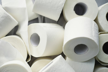 Toilet paper in a roll. Snow-white soft three-layer toilet paper. Lack of hygiene products. Primary protection and disinfection.