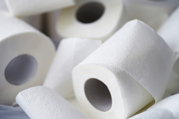 Toilet paper in a roll. Snow-white soft three-layer toilet paper. Lack of hygiene products. Primary protection and disinfection.
