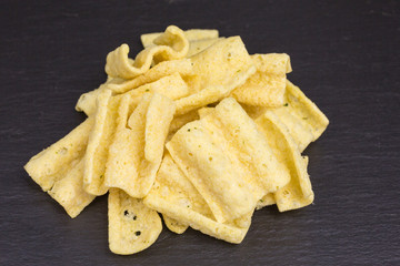 healthy snack of low-fat lentil chips with herbs and sour cream seasoning