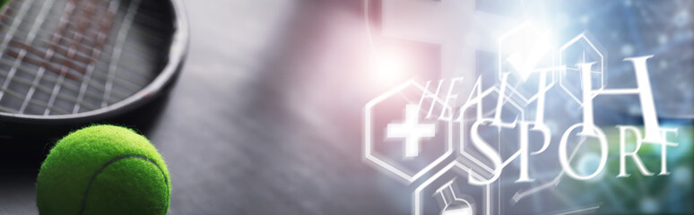 Sport and healthy lifestyle. Tennis. Yellow ball for tennis and a racket on the table. Sports background with tennis concept.