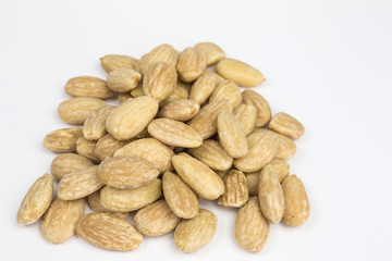 heap of salted roasted almonds for a healthy snack