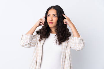 Naklejka premium Mixed race woman over isolated white background having doubts and thinking