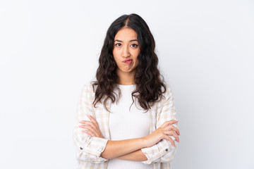 Fototapeta premium Mixed race woman over isolated white background feeling upset