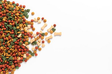 Above or Top view. Colourful Dried dog food on white background. Grain pet food banner background with copy space for text design.