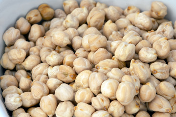 A pile of dried garbanzo beans, close up. 