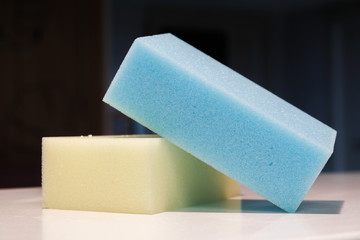 Yellow and blue sponge in bathroom
