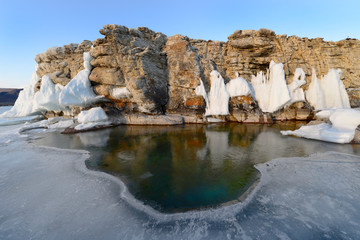 Ice is melting on Lake Bakal. Ice on the rocks.