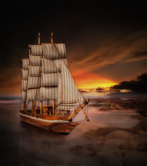 sailing ship at sunset