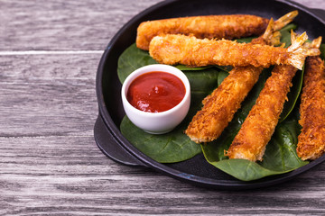 Tempura deep fried shrimp fish with tomato sauce. street food.