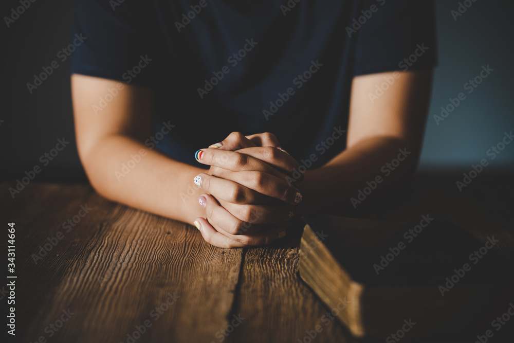 Wall mural Praying hands of teen girl