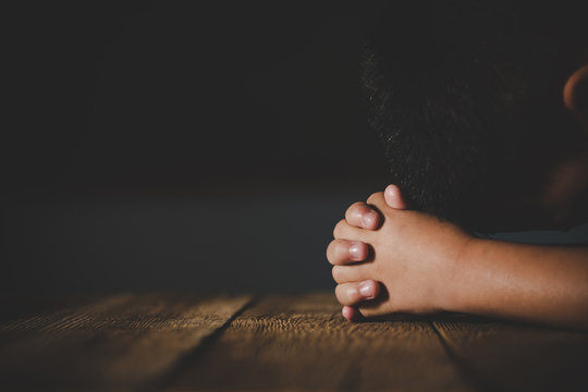 Praying hands of little boy