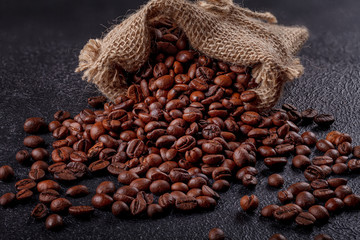 Canvas bag with coffee beans on a beautiful black background