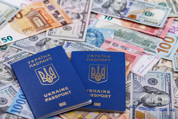 Ukrainian passport and currency of different countries necessary for travel and trips abroad.