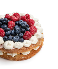 Victoria sponge cake with whipped cream and berries on top isolated on white