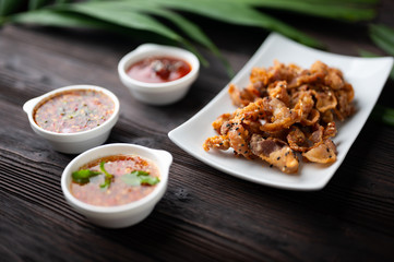 Crispy fried sliced belly pork with spicy sauce