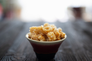 Homemade deep fried crispy pork rind in bowl.