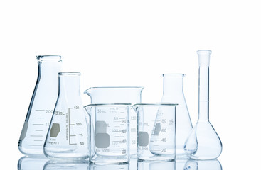 Flasks and measuring beaker for science experiment in laboratory isolated