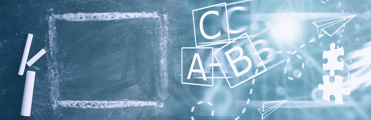 Chalkboard. Crayons for writing on a blackboard. Learning concept. School teaching chalk board.