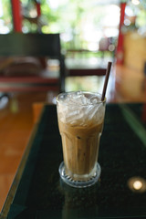 Cold ice milk coffee in glass cup