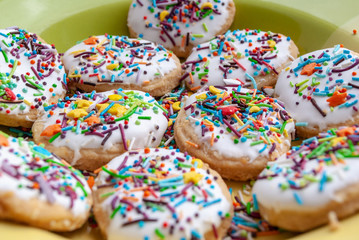 texture, background, baking cream dessert sweet, happy easter. glaze. multi-colored topping, cookies on a plate