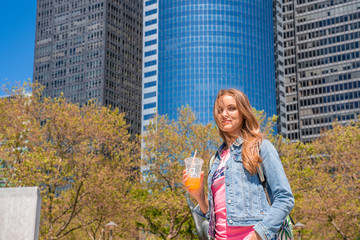 Girl drinking juice in New York city.