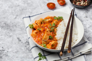bowl with spicy chicken, vegetables and rice