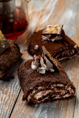 Close up of chocolate roulade with whipped cream cheese and chocolate