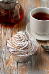 Homemade berry tartlet with whipped burnt crud, served with black tea