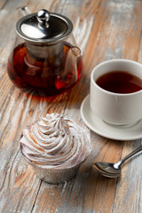 Homemade berry tartlet with whipped burnt crud, served with black tea