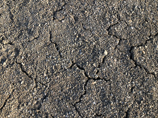 Cracked dry ground mud, dried under sun road