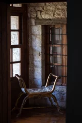 Foto op Canvas Seat next to window in Old Town Home Ioannina Grece. Pirsinela listed building. © Antonios