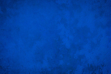 Fototapeta na wymiar Abstract grunge decor. Beautiful dark blue stucco wall background. Space for designing and inserting text.
