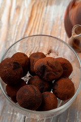 Homemade truffle balls made of chocolate praline and coated in cocoa powder