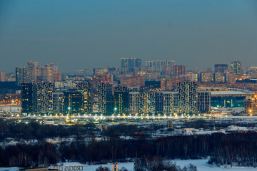 Night city. Construction of residential buildings in Moscow