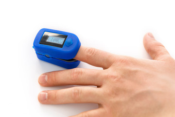 Finger Pulse Oximeter blue used for measuring the pulse rate and oxygen level