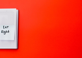 open notebook with a sticker that says 