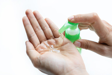 Woman applying sanitizer gel onto her hand for protection against infectious virus, bacteria and germs in white background.