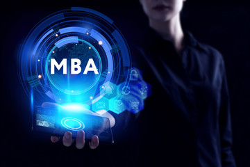 Business, Technology, Internet and network concept. Young businessman working on a virtual screen of the future and sees the inscription: MBA