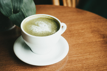 cup of coffee on table in cafe